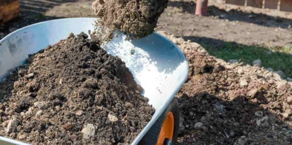 fill the earth in a wheelbarrow for construction