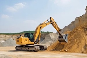bright yellow construction excavator at work on building site