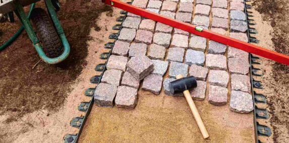 SW Florida landscaping sand being used as base foundation for brick walkway