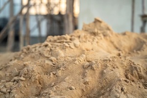 pile of fine landscaping sand for building the house that stack on the ground on FDOT construction site as blurred background