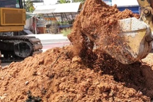  fill dirt loader machines are working in the highway