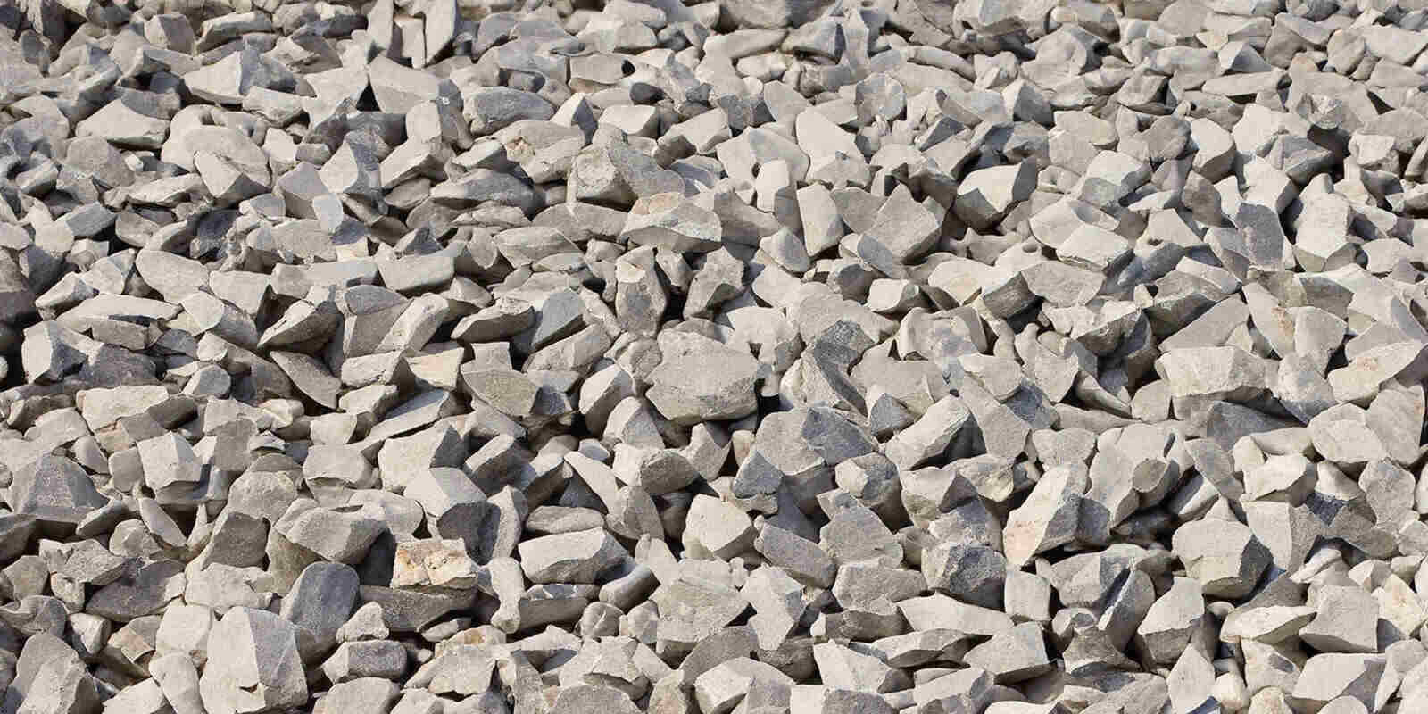 Crushed stones and pebbles in the. Gravel stone texture concept