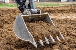 excavator holding fill dirt
