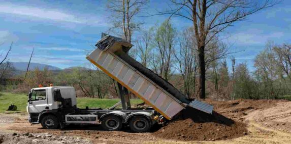 Dump Truck Unloading Fill Dirt at Fort Myers, FL Construction Site