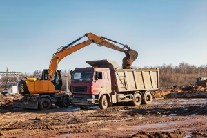 Excavator Loading A Truck with Fill Material