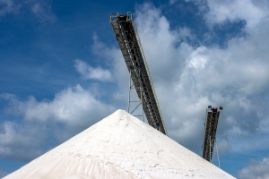 Large Pile of White Sand for Construction Near Conveyor Belt