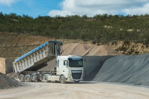 Truck in Aggregate Quarry with Dump Raised After Unloading Sand