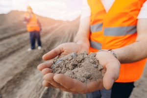 Engineer Holding Sand to Check Quality for Construction Project