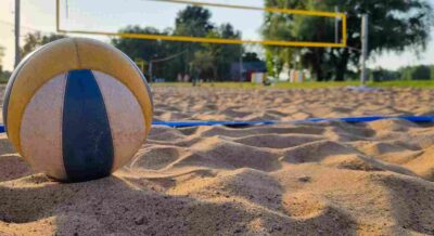 Ball Placed on Professional Grade Sand Volleyball Court