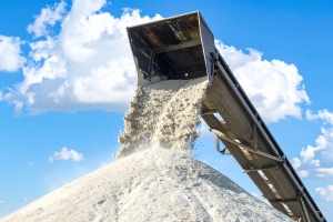 Conveyor Belt Dumping White Beach Sand Onto A Large Pile