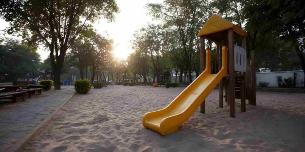 Playground with Sand Surface Outside a Commercial Property