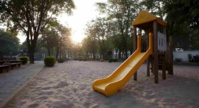 Playground with Sand Surface Outside a Commercial Property