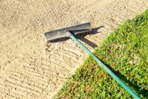 Rake Moving Over Sand Surface Outdoor for Maintenance
