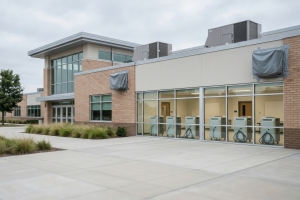 Modern Commercial Brick and Glass Building with Light-Colored Aggregates Outdoor Area