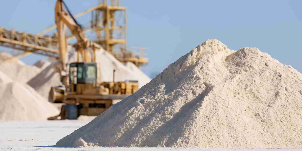 Industrial White Sand Mining Site with Large Heavy Machinery