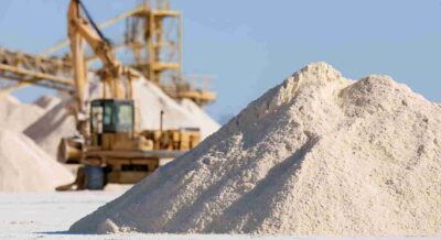 Industrial White Sand Mining Site with Large Heavy Machinery